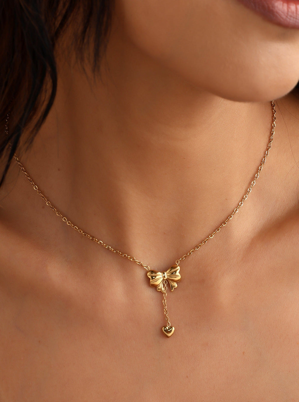 Gold Plated Stainless Steel Anti Tarnish Heart Themed Bow inspired Pendant Necklace