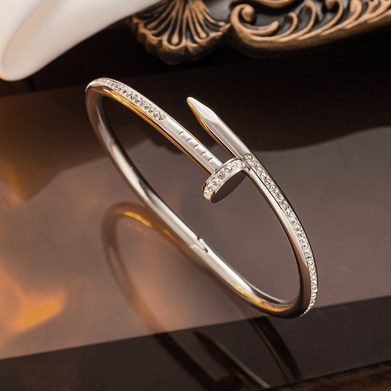 Stainless Steel Gold Plated Anti Tarnish AD Studded Nail Bracelet for Women