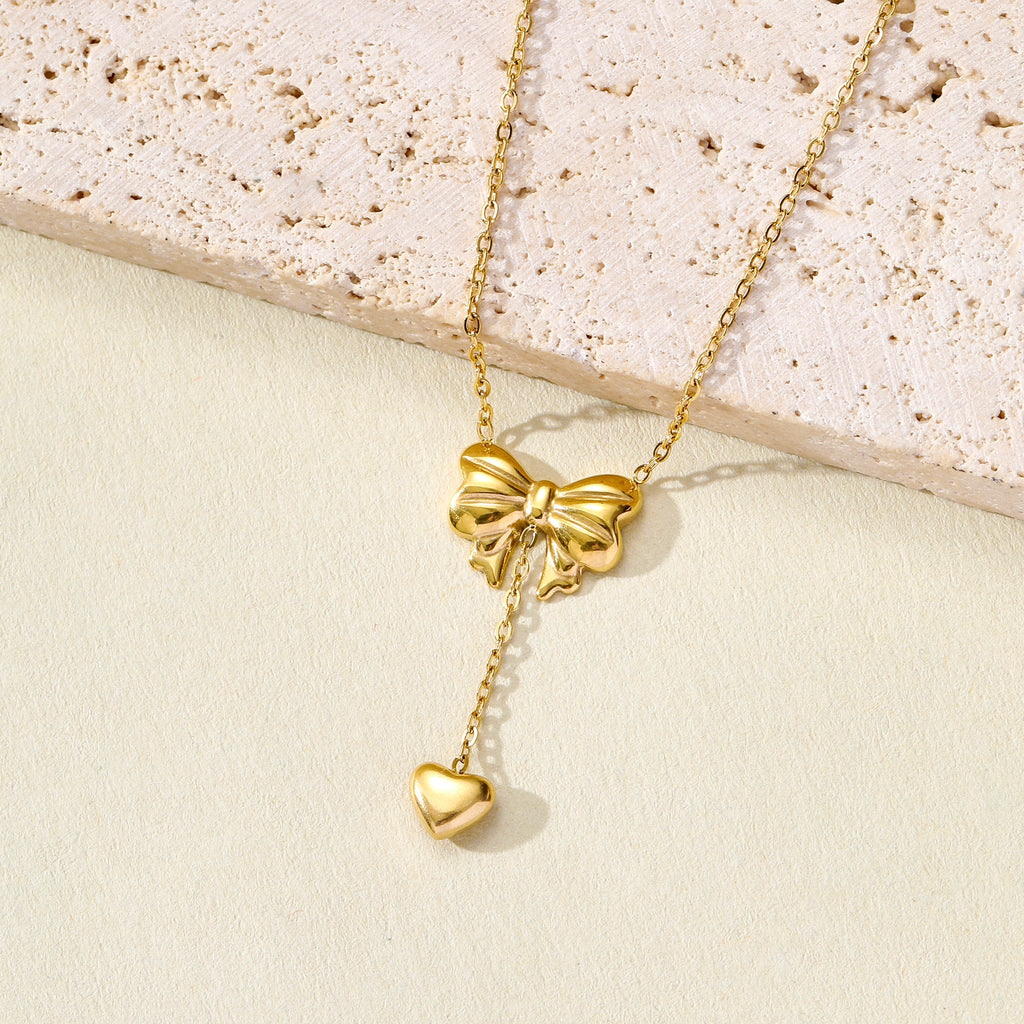 Gold Plated Stainless Steel Anti Tarnish Heart Themed Bow inspired Pendant Necklace
